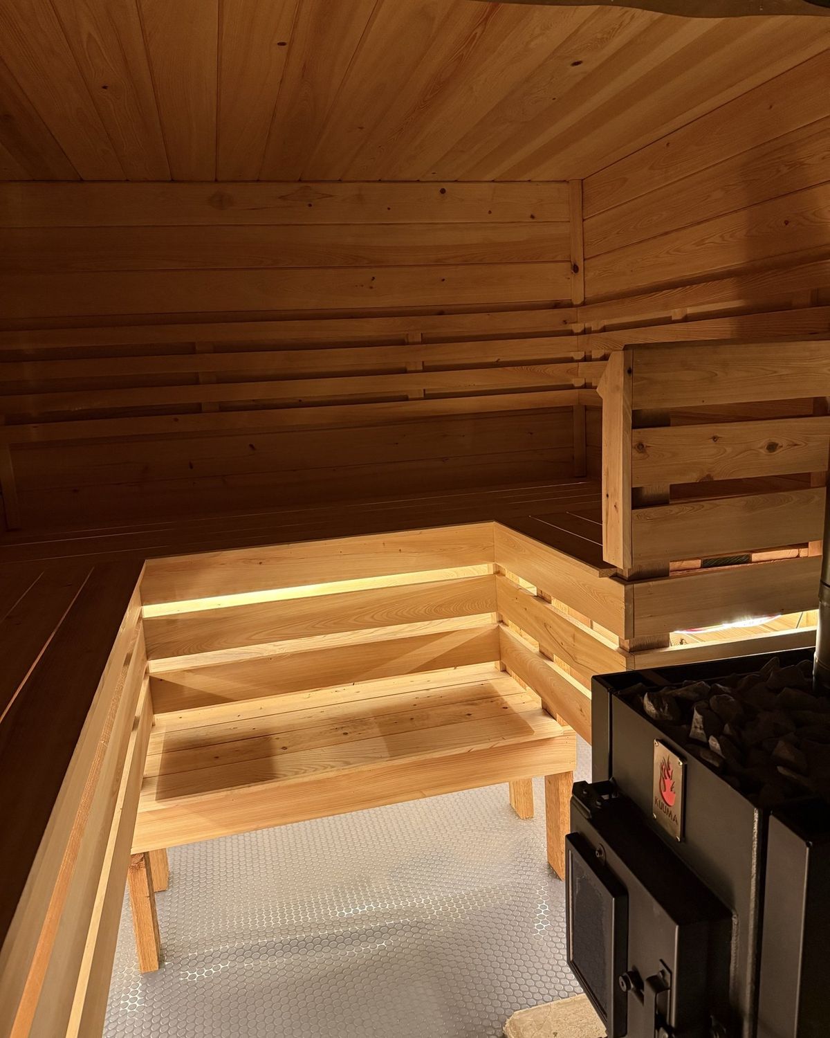 Warm cedar interior with tiered benches