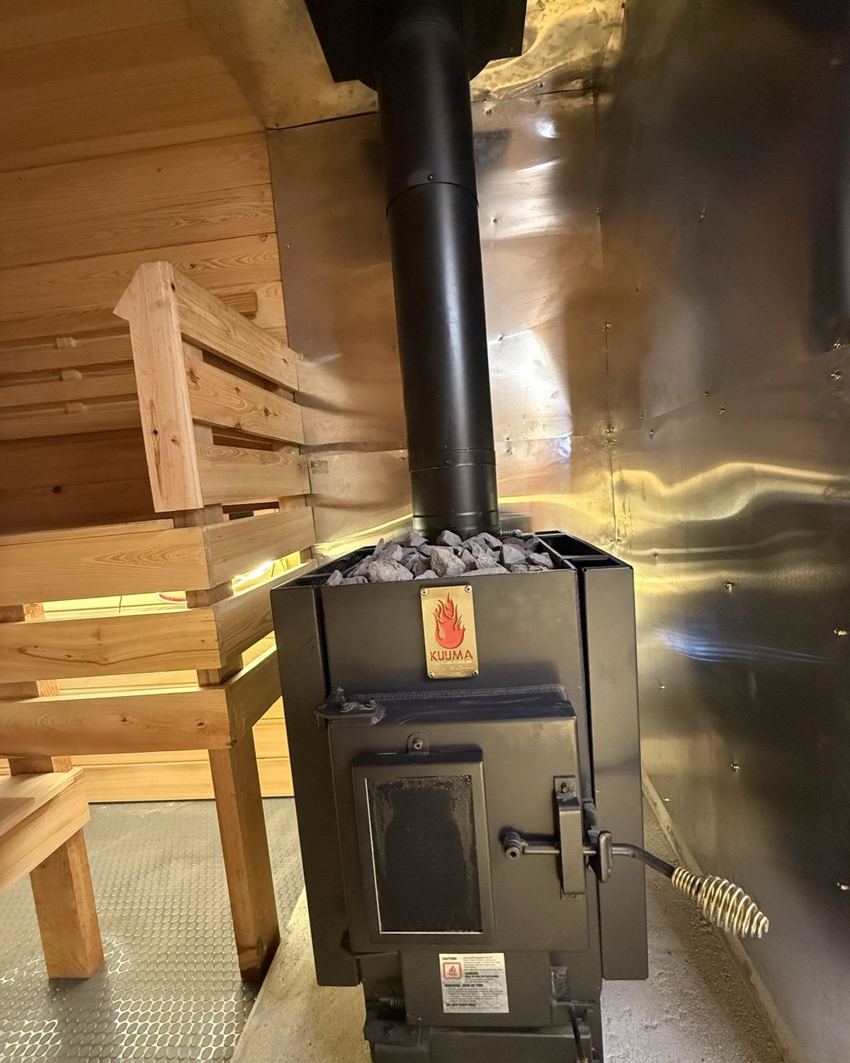 The Kuuma wood-burning stove topped with sauna stones